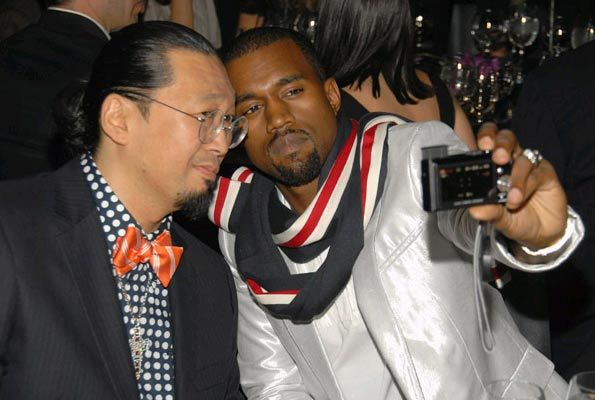 Kanye West photographing Takashi Murakami.